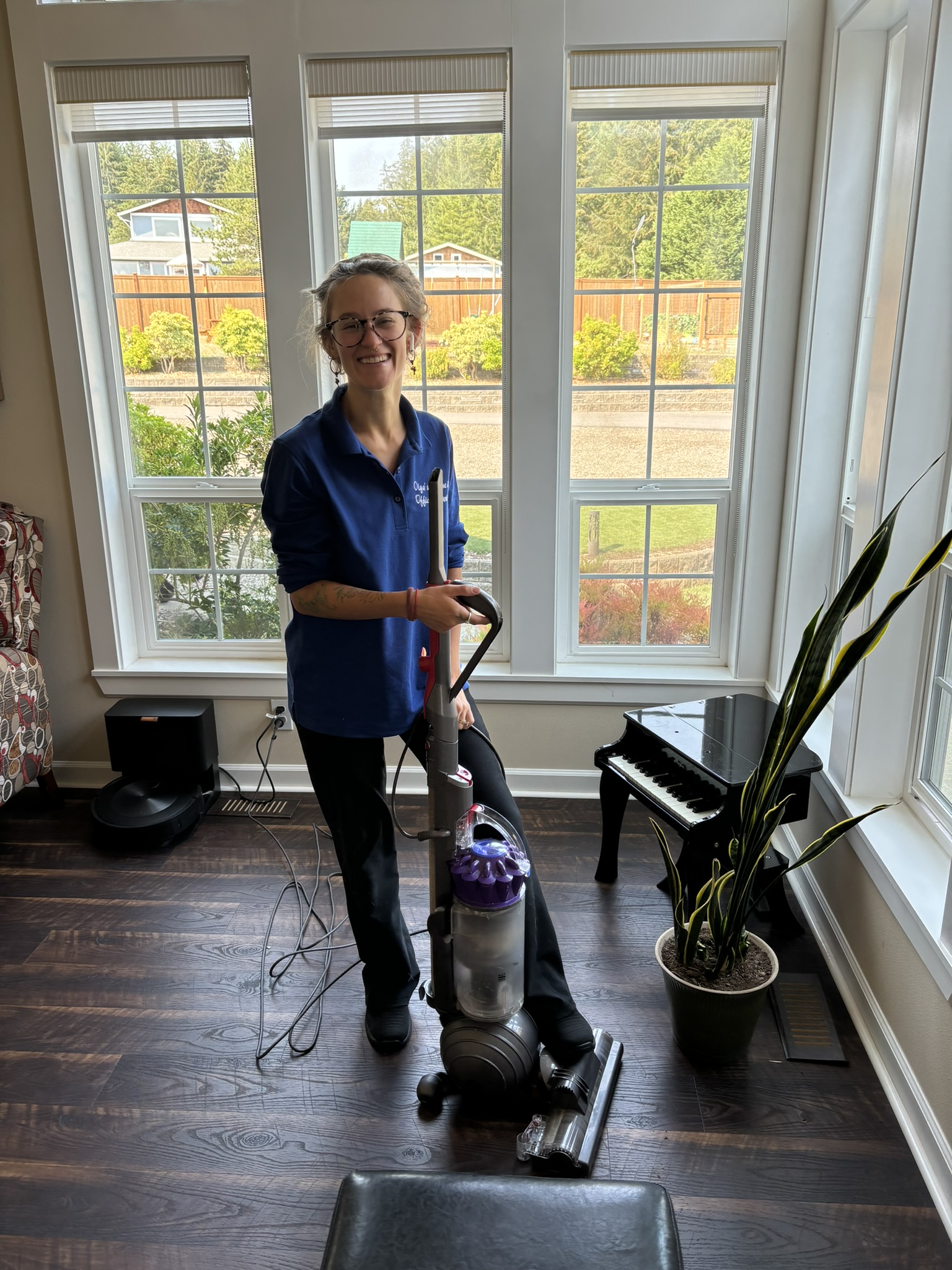 Team member vacuuming living room